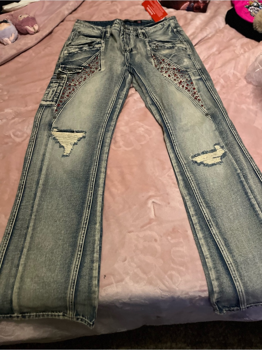 Men's Distressed Light Blue Jeans with Studded Accent